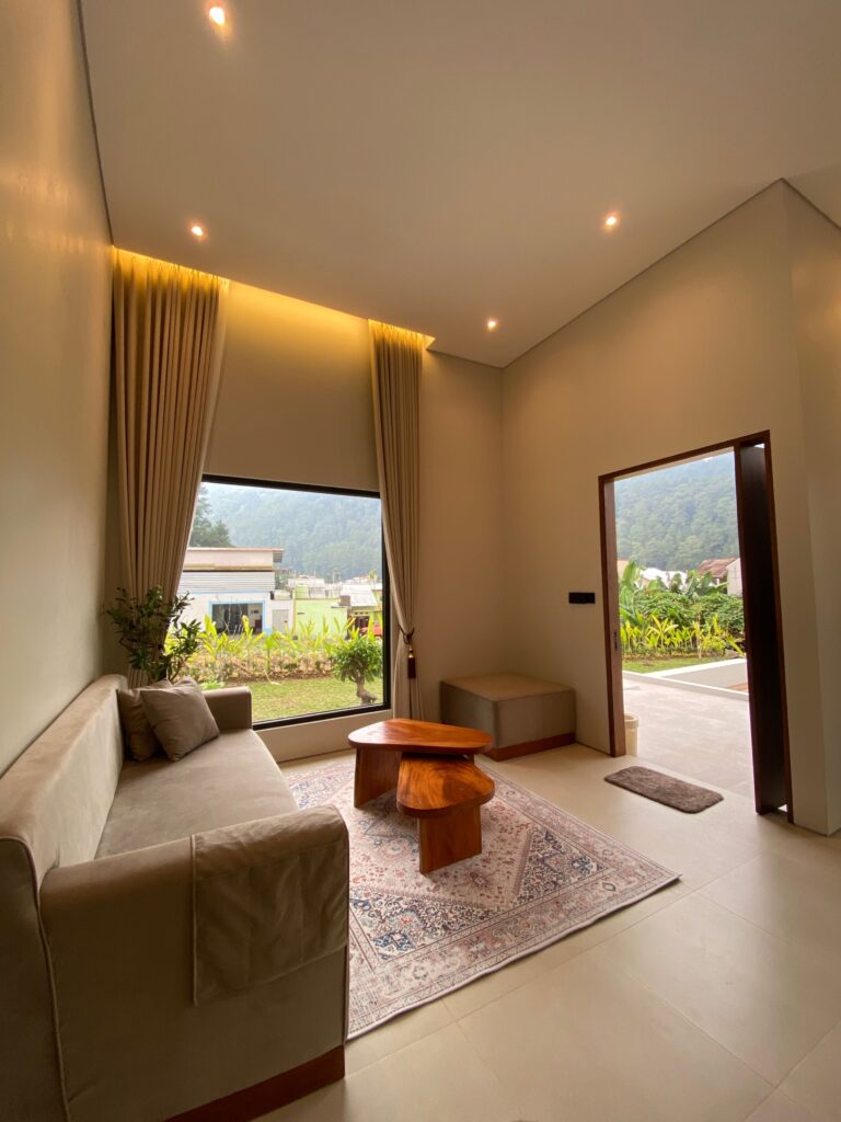Cozy modern living room in Central Java with scenic mountain views.